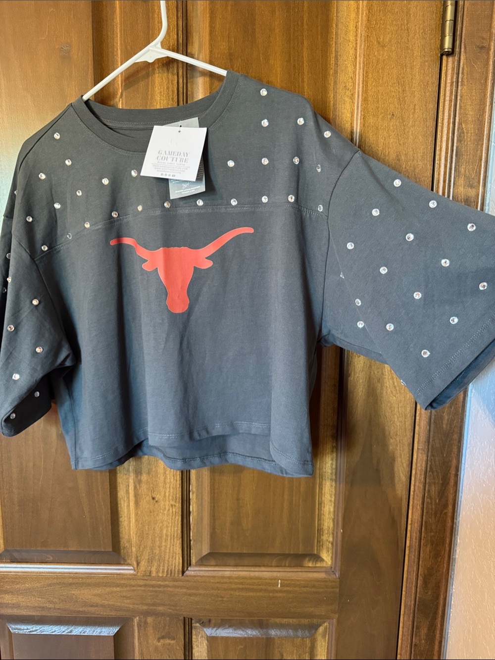 Womens’ Gray Crop tshirt with Orange Longhorn Graphic, rhinestone sleeves.